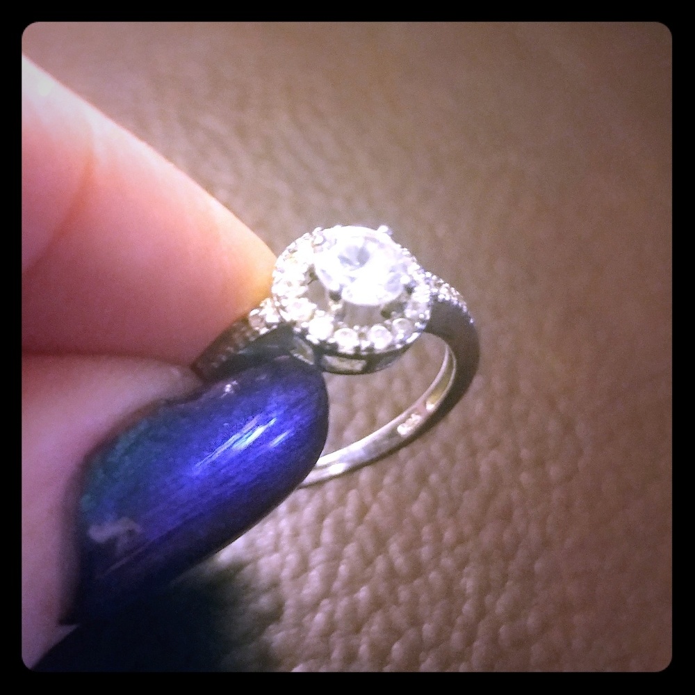 Sterling silver halo engagement ring.